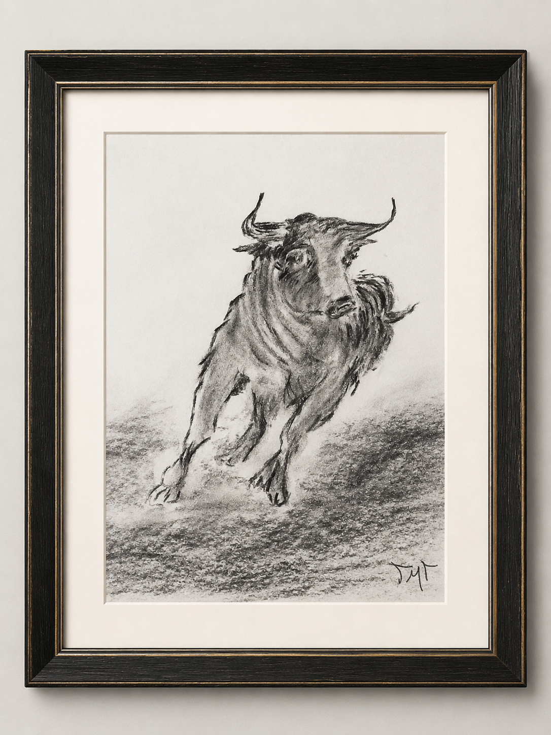 Dibujo enmarcado de un toro corniveletero en movimiento